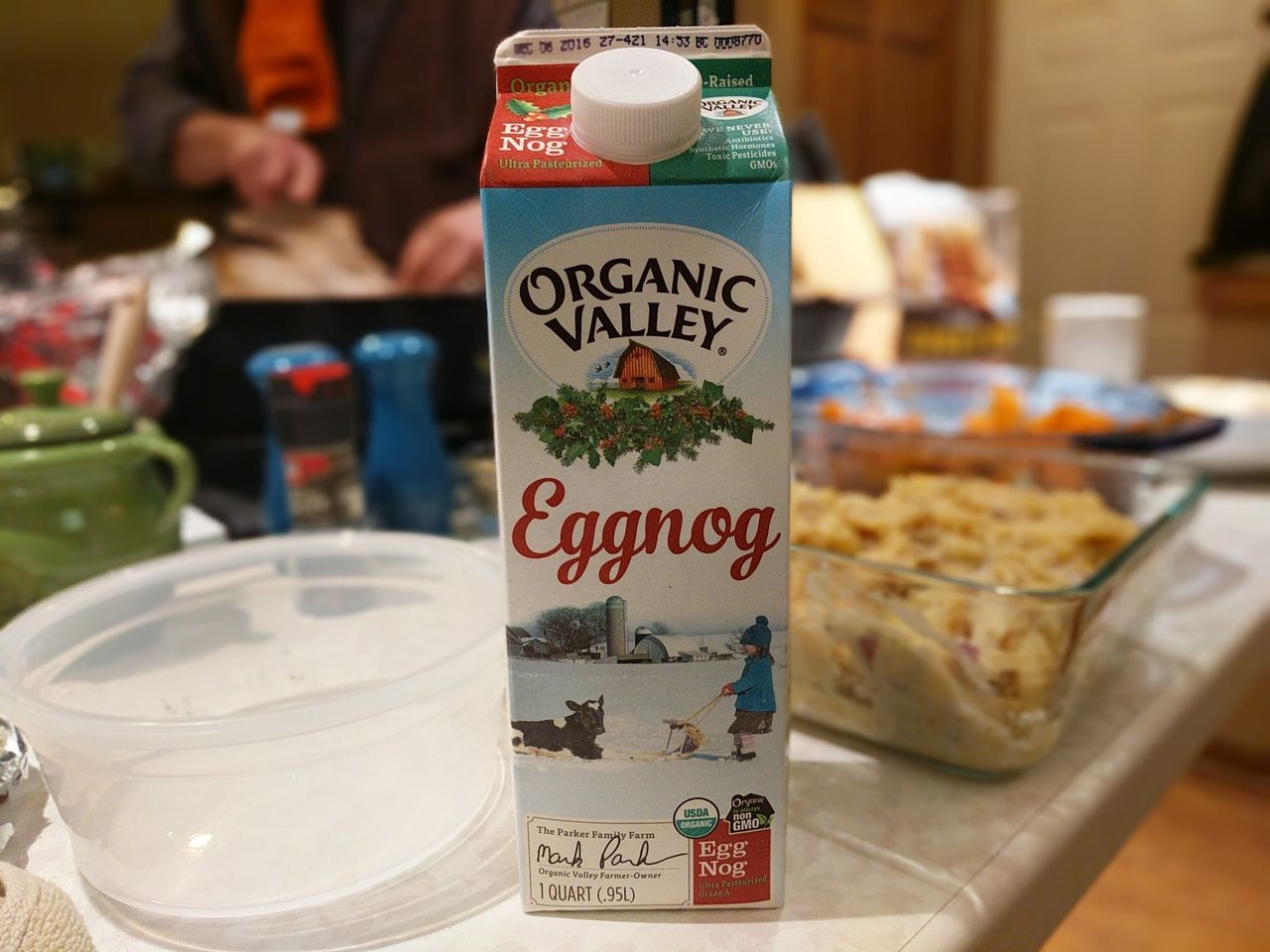 A carton of Organic Valley Eggnog on a table set with holiday dishes